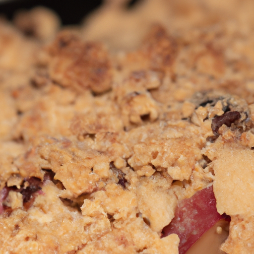 A close-up of a freshly baked apple crumble with a golden crispy topping